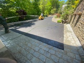 A custom paved edge and driveway in Canton MA by Norfolk Asphalt Paving & Excavation
