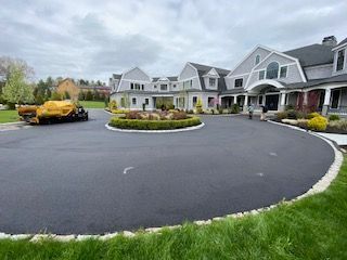 A residential asphalt driveway in Canton MA by Norfolk Asphalt Paving & Excavation