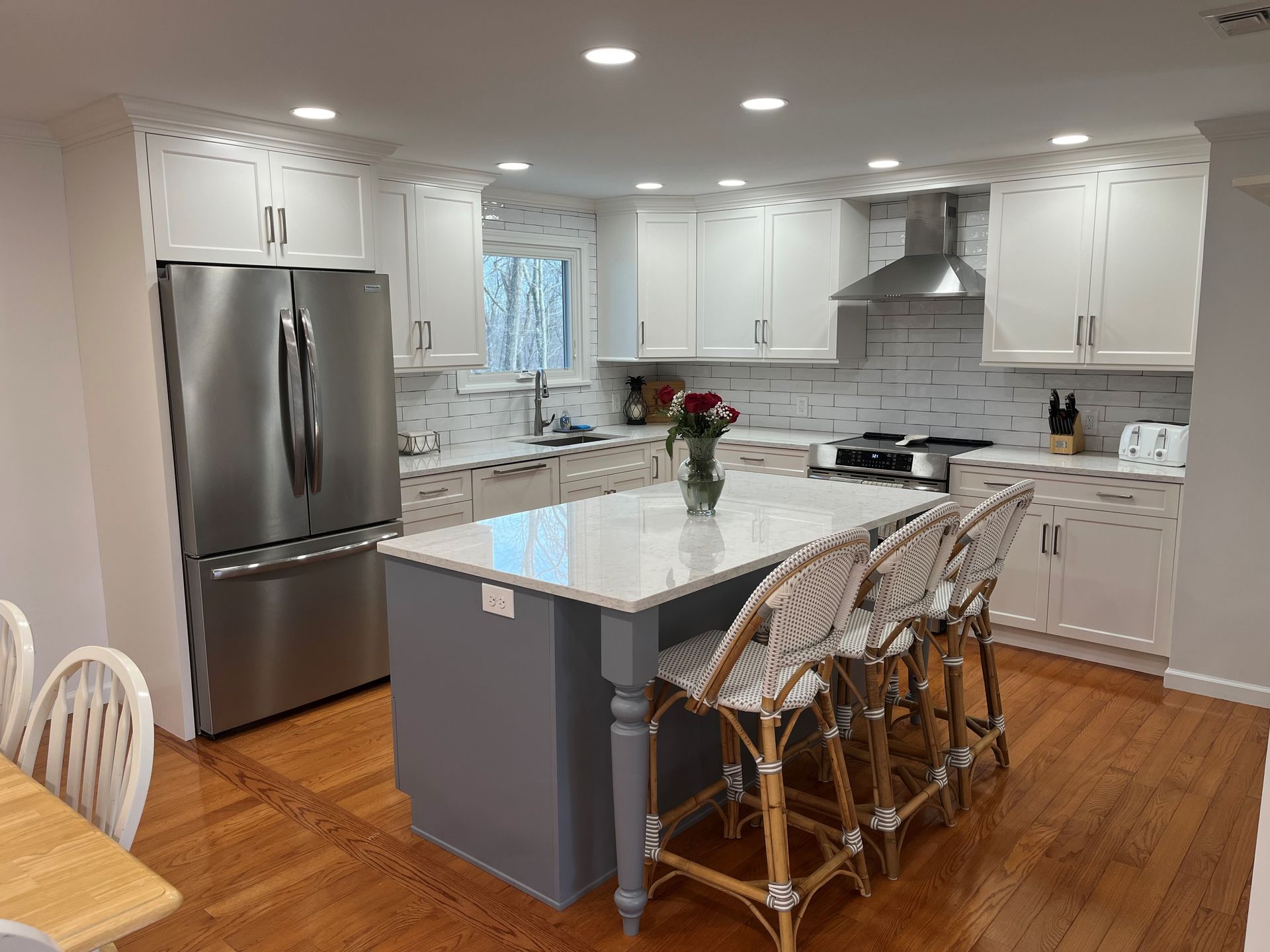 Scandinavian style cozy modern kitchen interior with a dining zone – Guilford, CT - Red Door Kitchen & Bath Studio