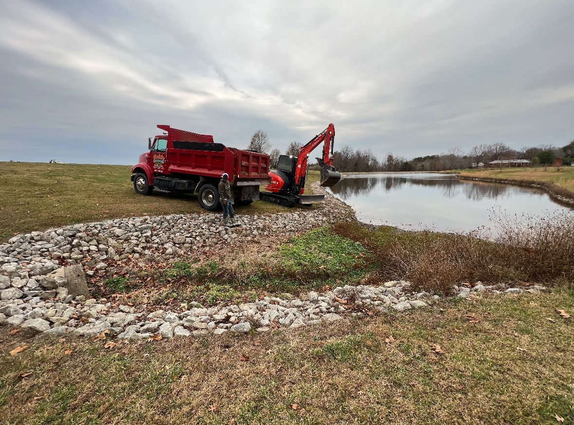A Red Dump Truck Is Parked — Scottsburg, IN — Babbs Land Management LLC