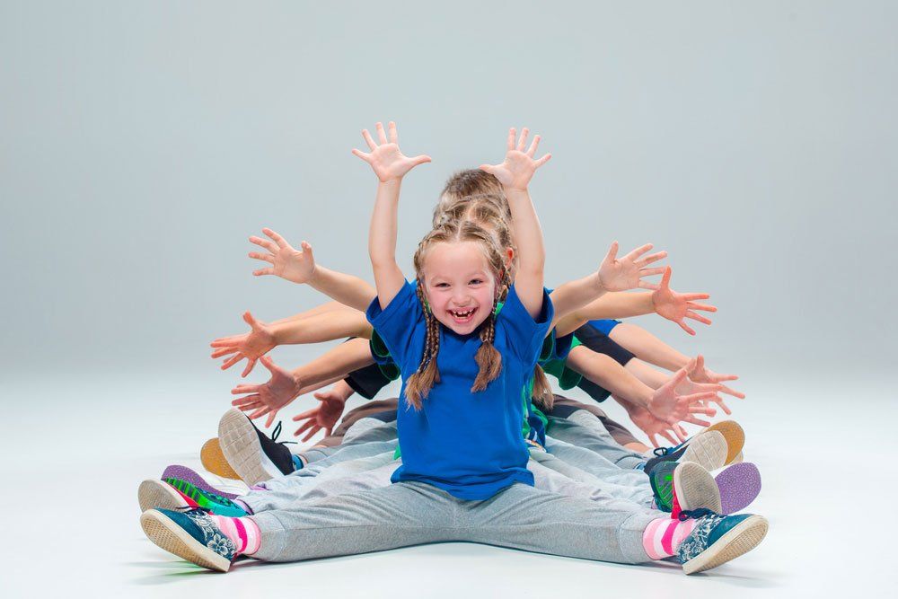 Kids Sitting In Line — Quality Shoe Shop in Maroochydore, QLD