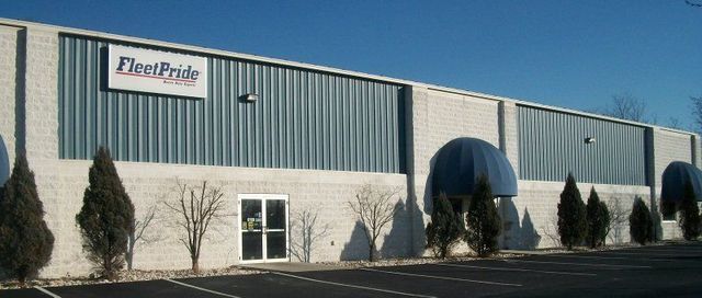 A Large Building with A Sign that Says Fleet Pride