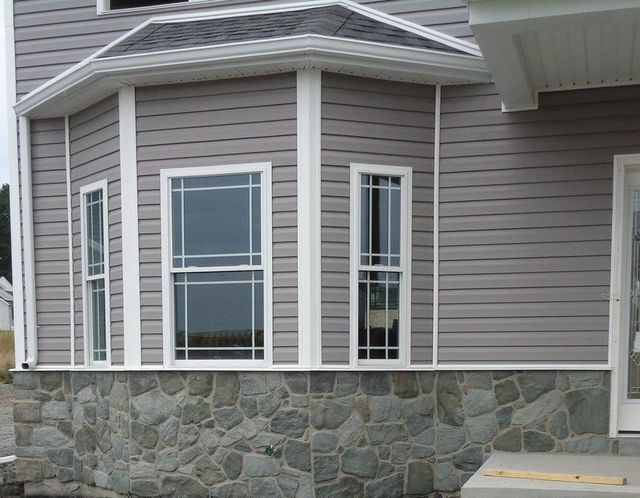 A House with A Bay Window and A Stone Wall