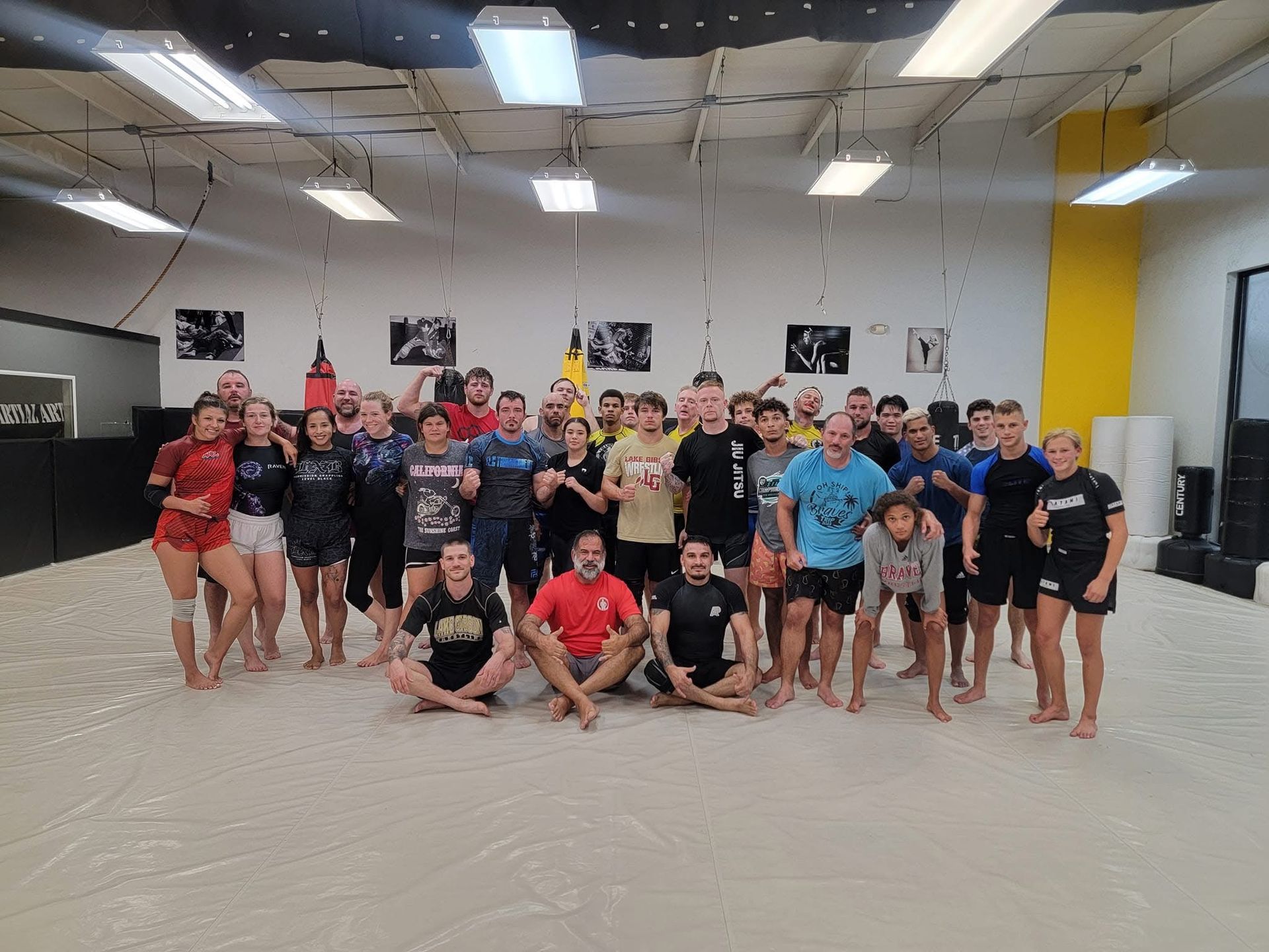 a man and a woman are practicing martial arts on a mat