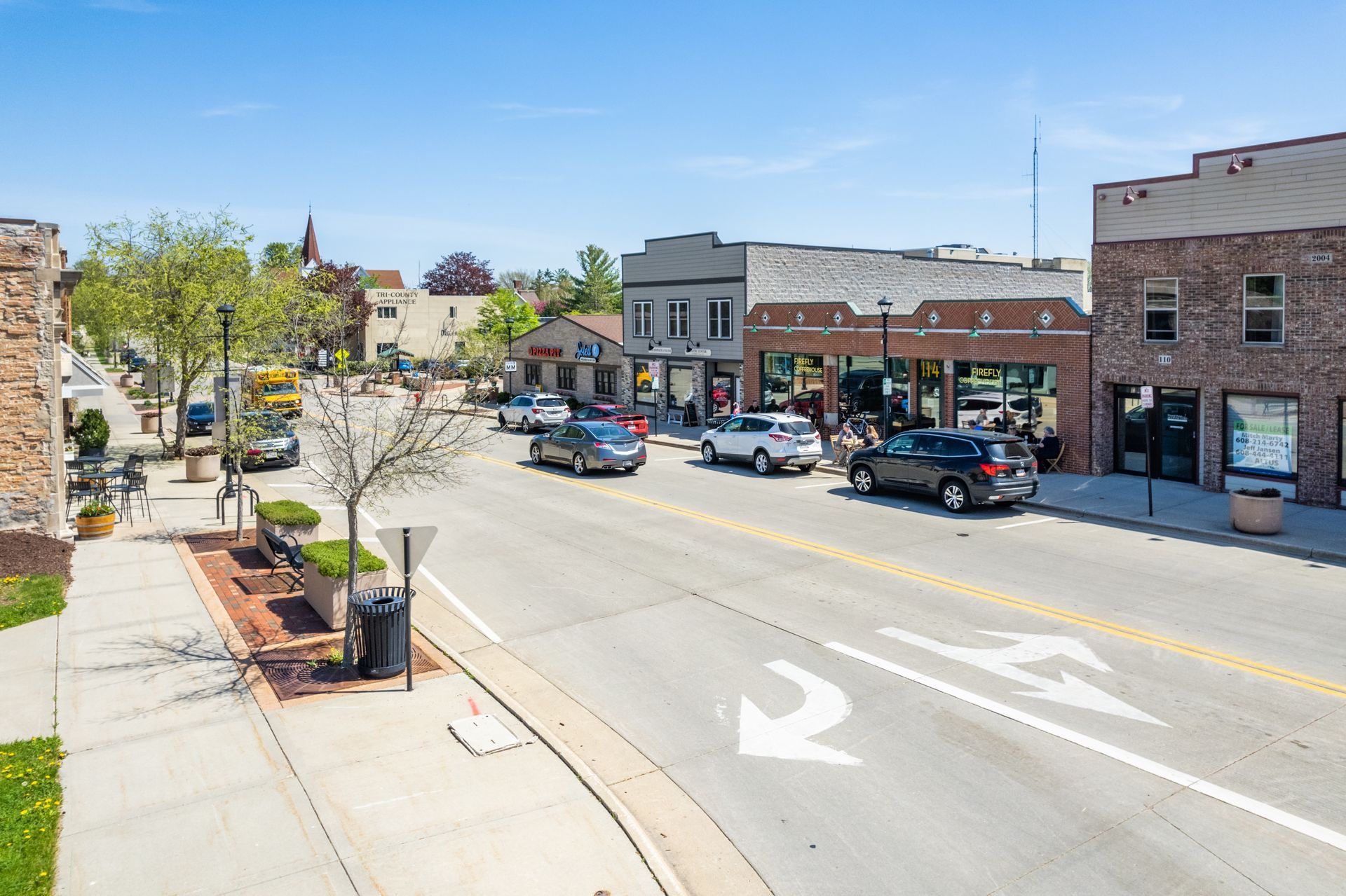 a busy street with a sign that says ' abercrombie & fitch ' on it