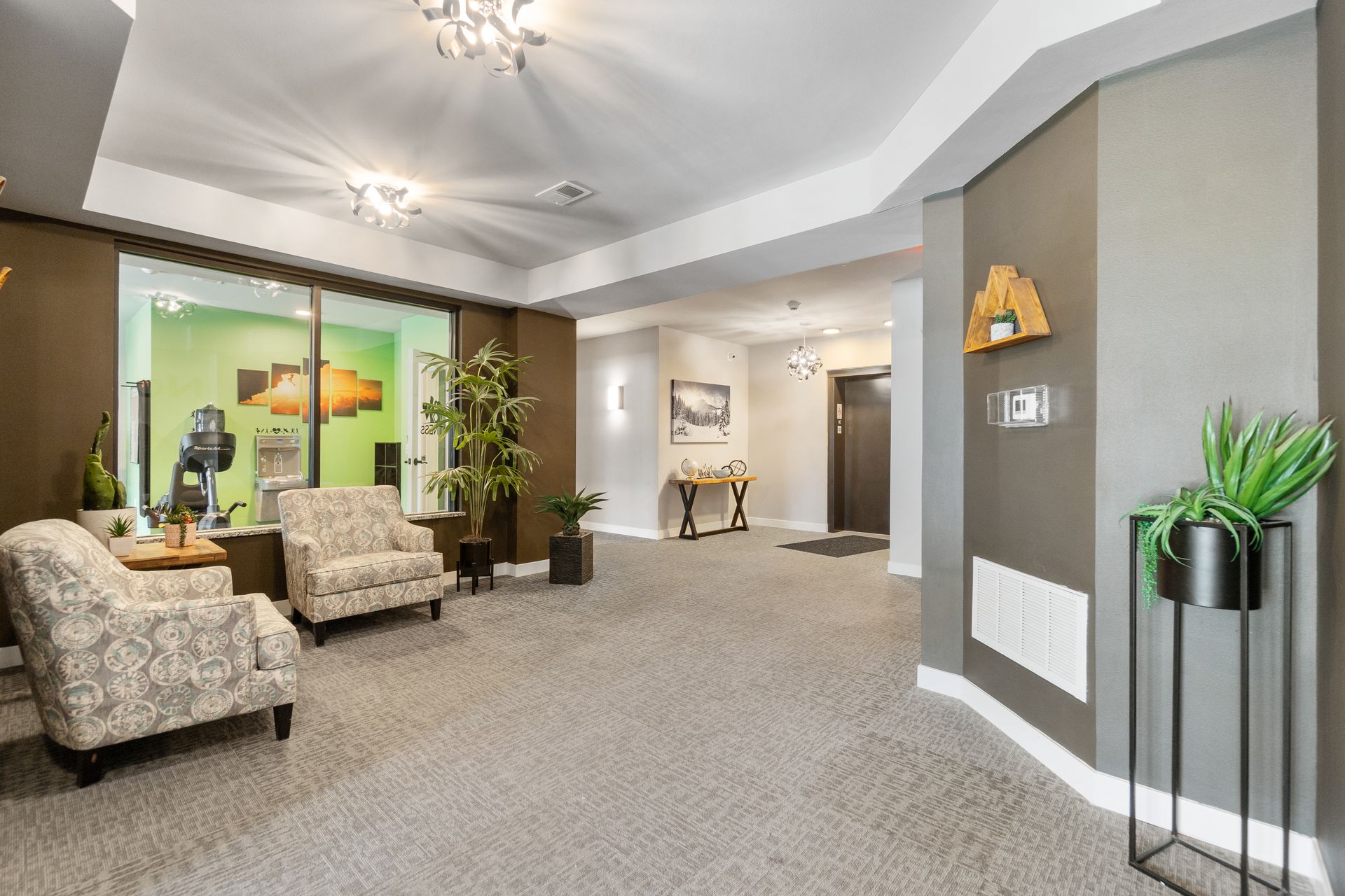 a hallway with a sign that says ' elevator ' on it