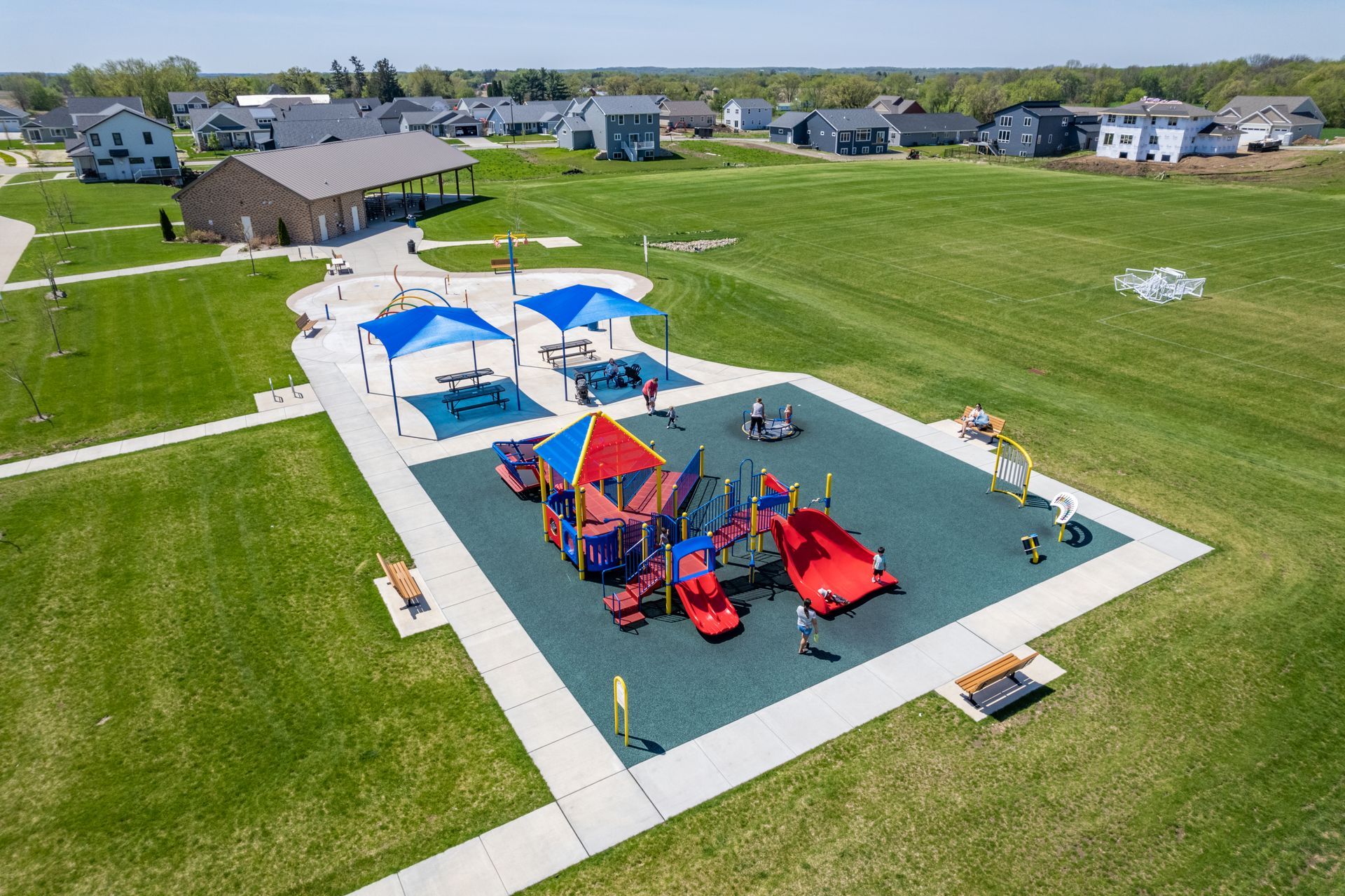 an aerial view of a playground in a residential area