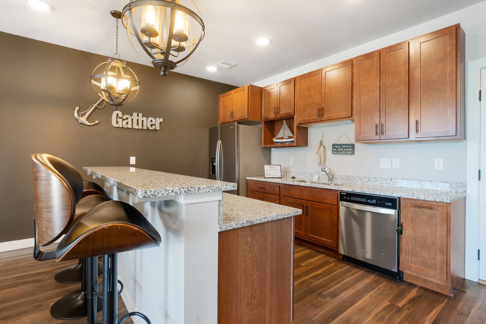 a kitchen with a gather sign on the wall