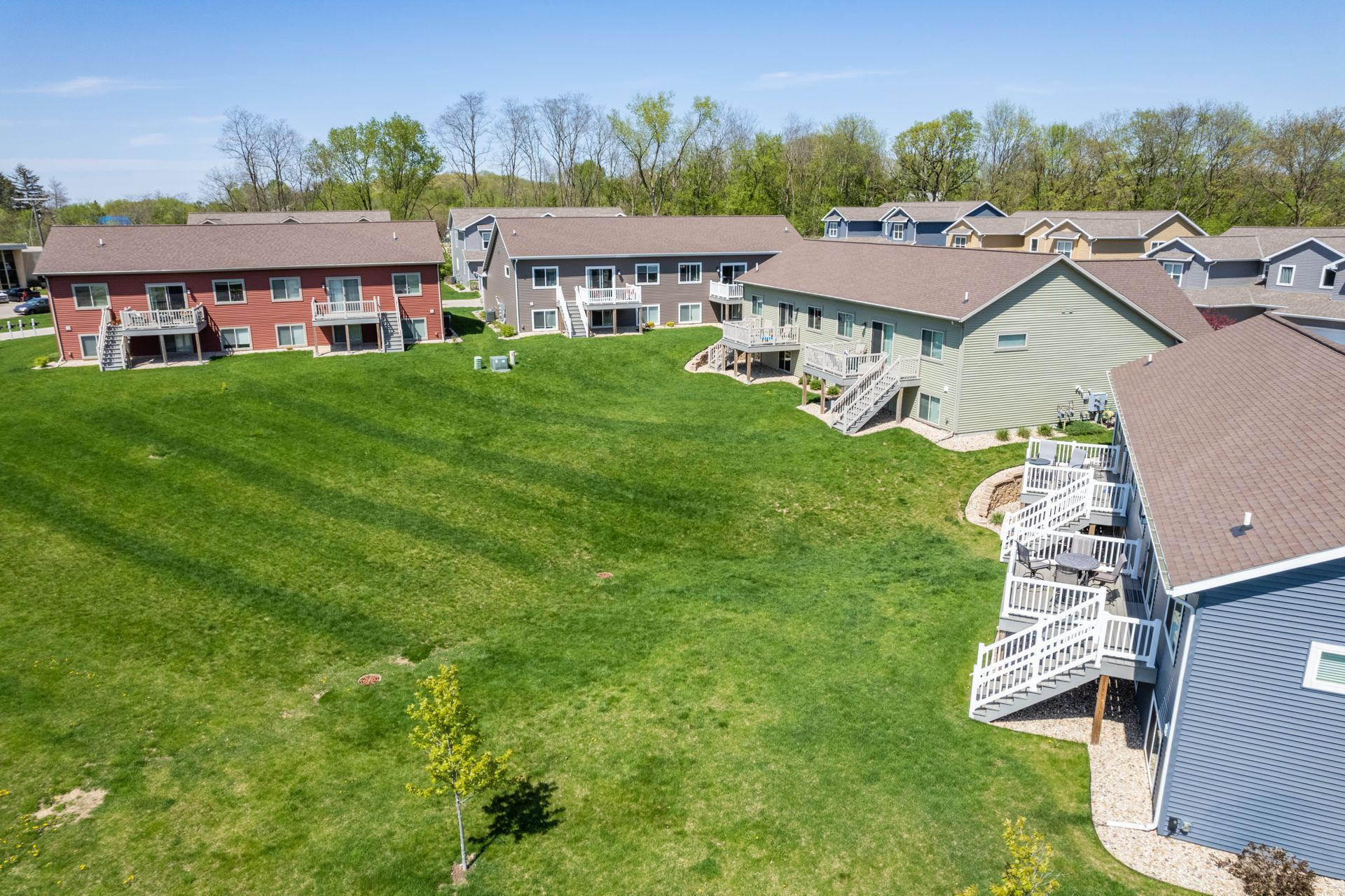 an aerial view of a row of apartment buildings