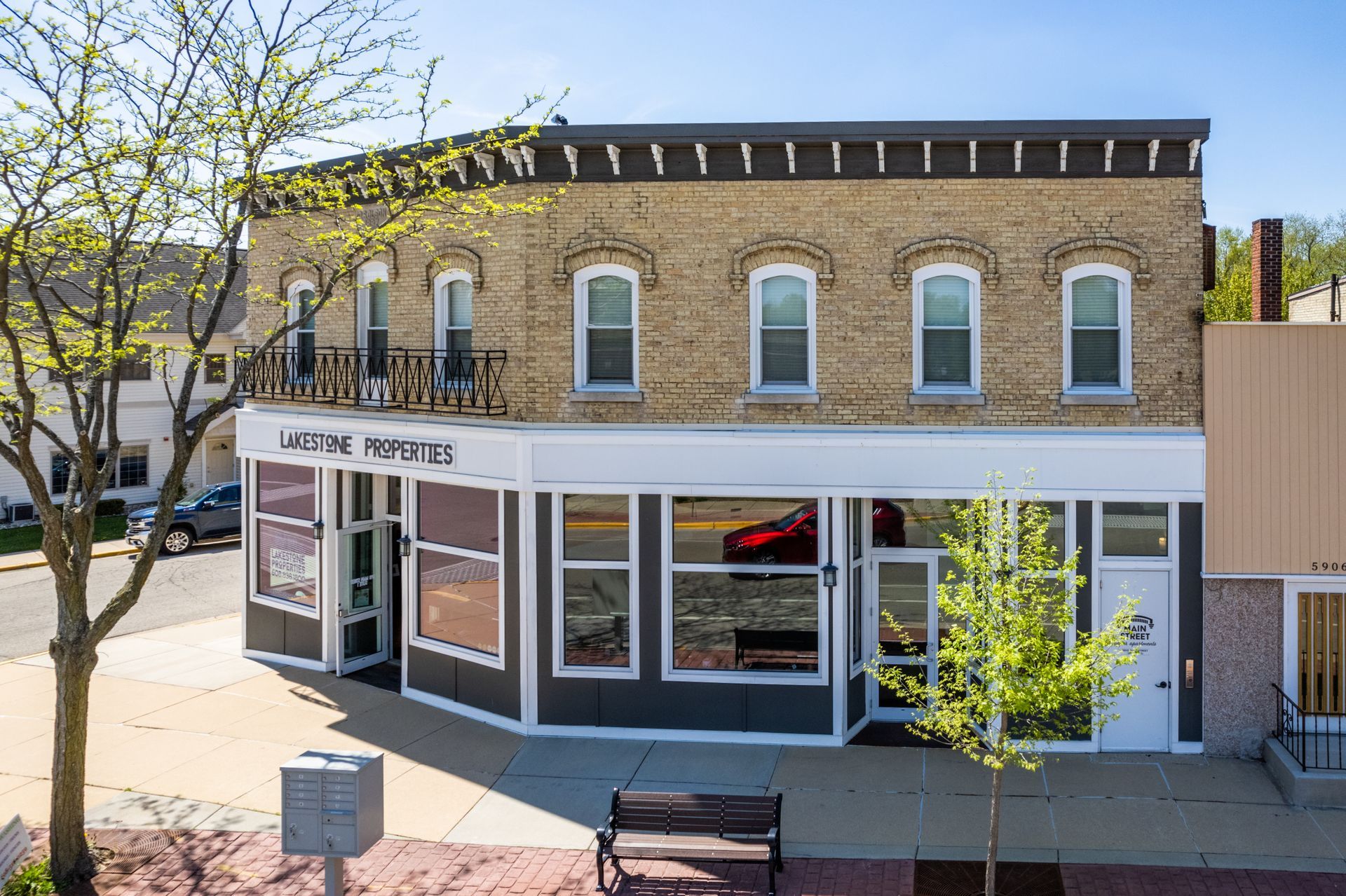 a building with a sign that says lakestone properties