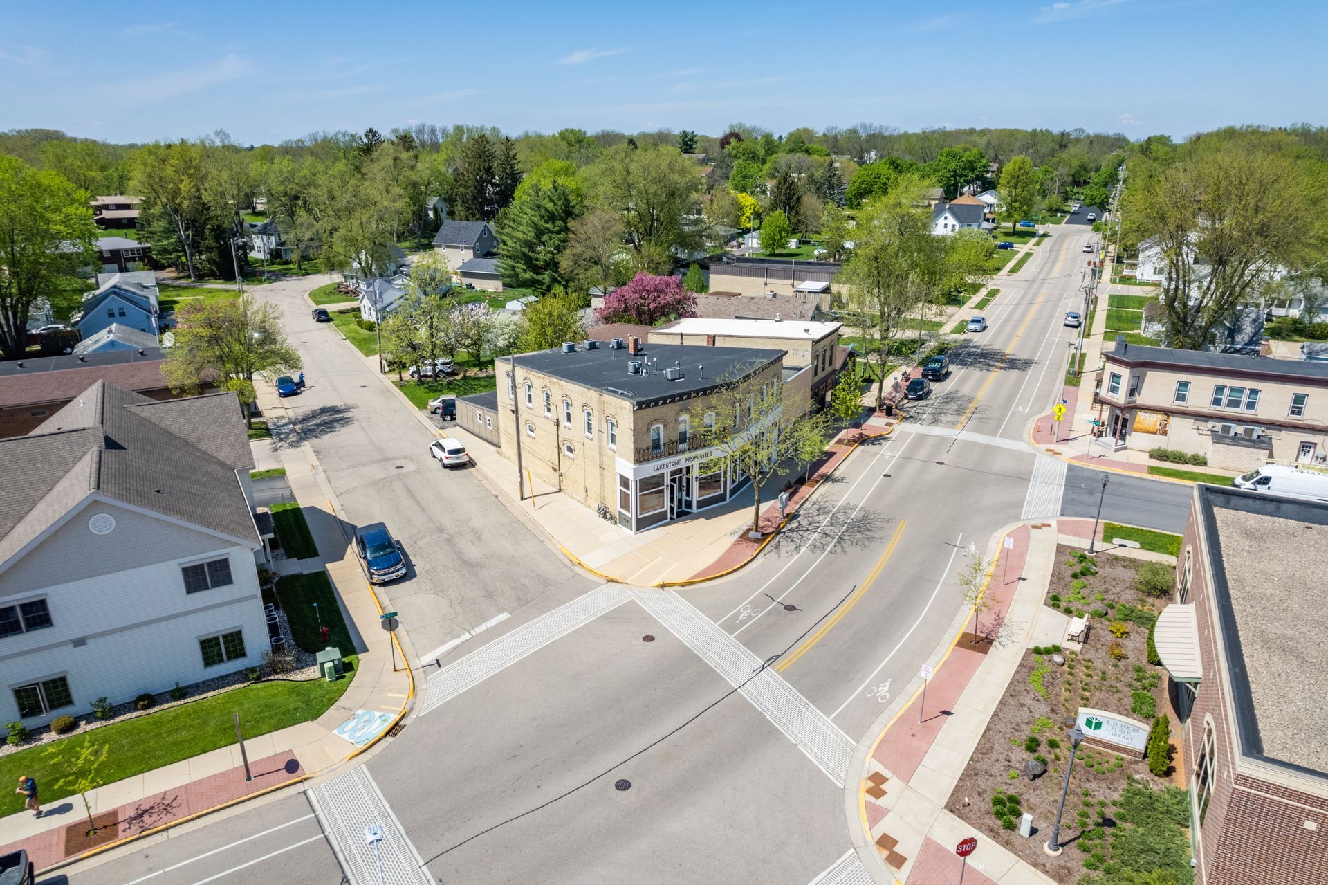 an aerial view of an intersection with a sign that says stop