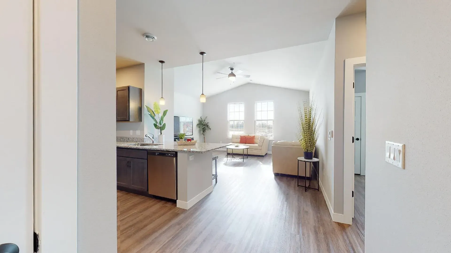 a kitchen with stainless steel appliances and granite counter tops