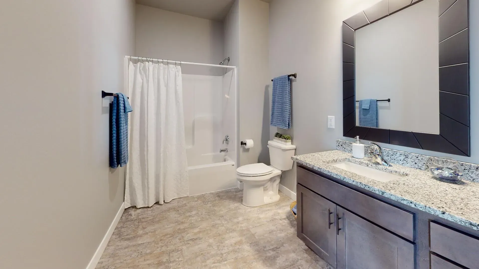 a bathroom with a toilet a sink and a mirror