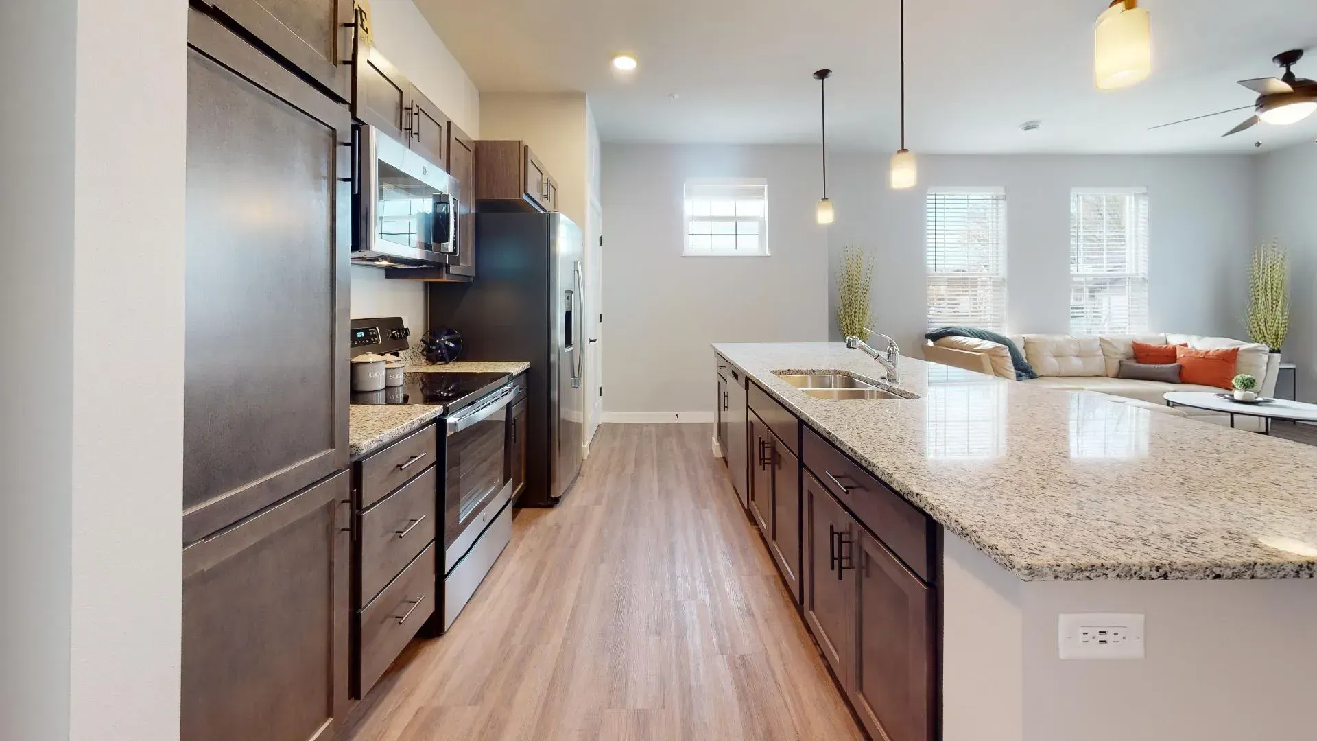 a kitchen with granite counter tops and stainless steel appliances