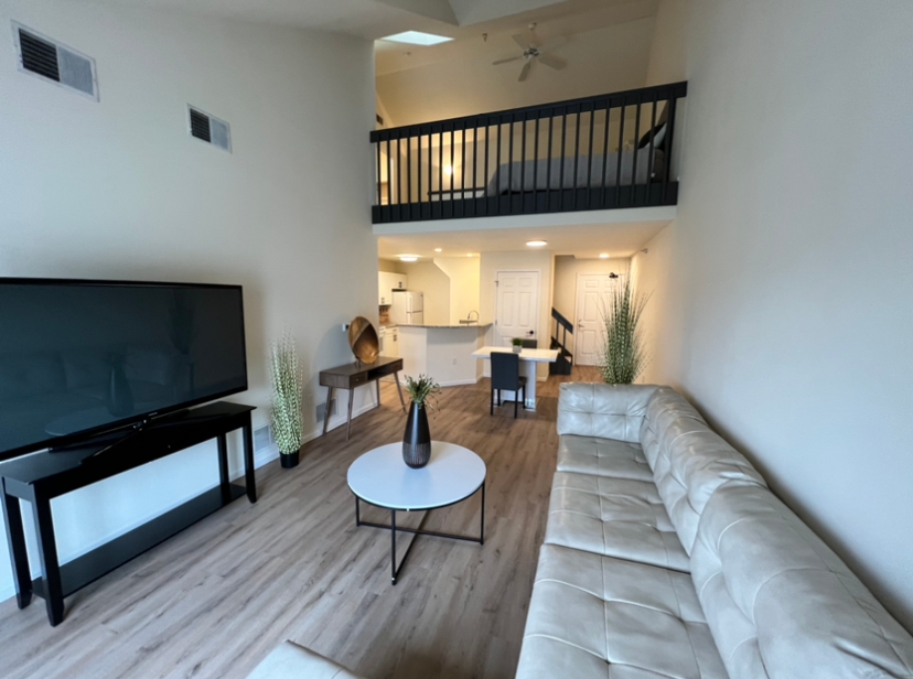 a living room with a couch and a flat screen tv