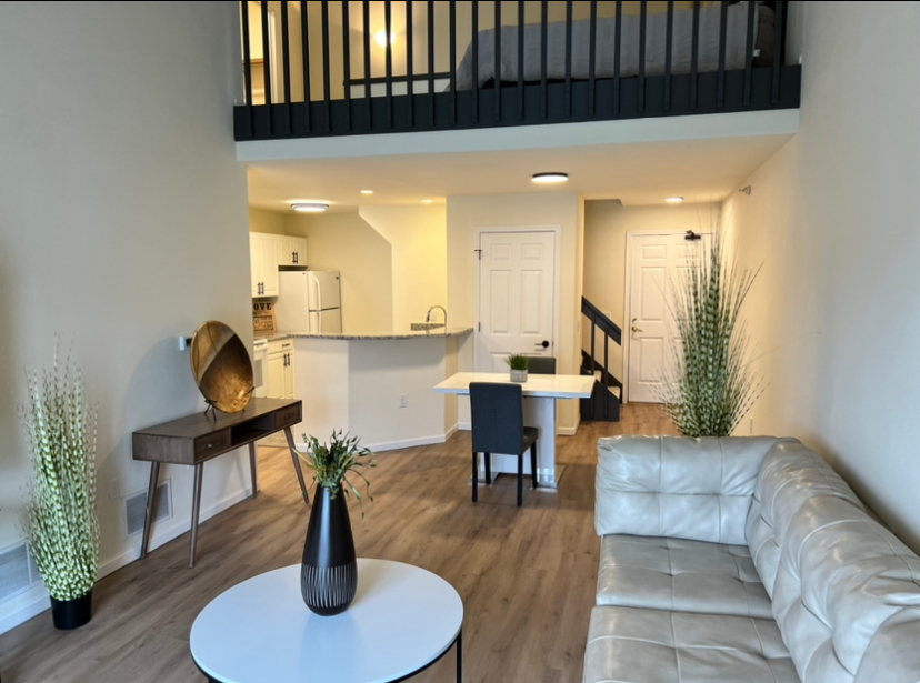 a living room with a couch and a table