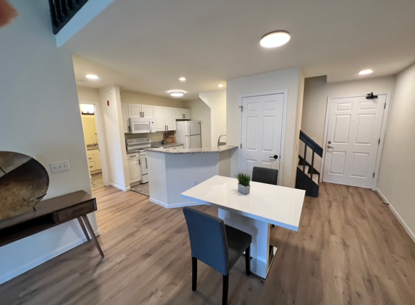 a kitchen with a table and chairs in it