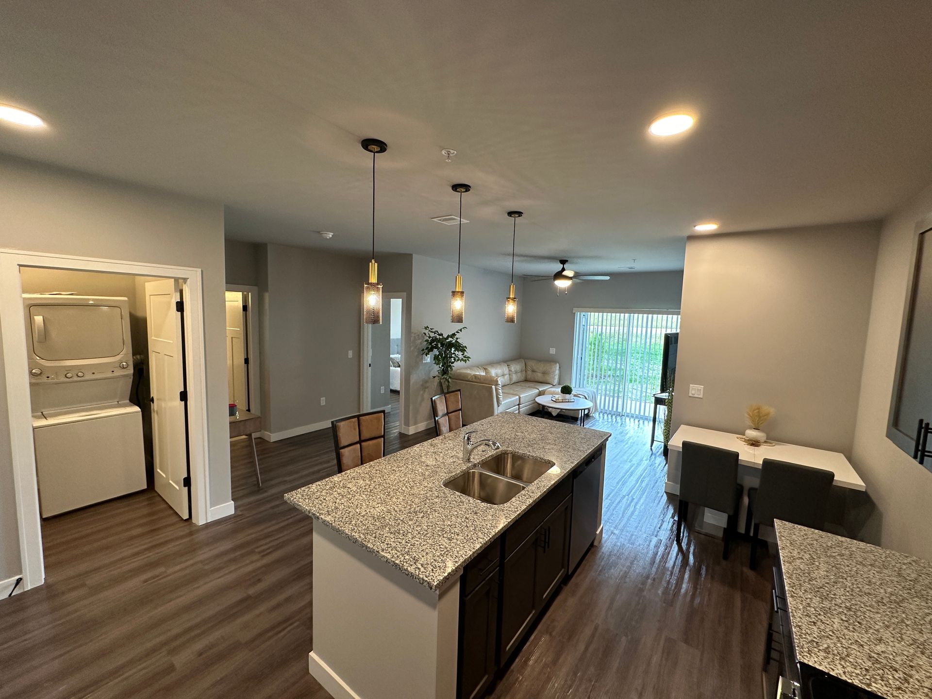 a kitchen with a sink and a washer and dryer