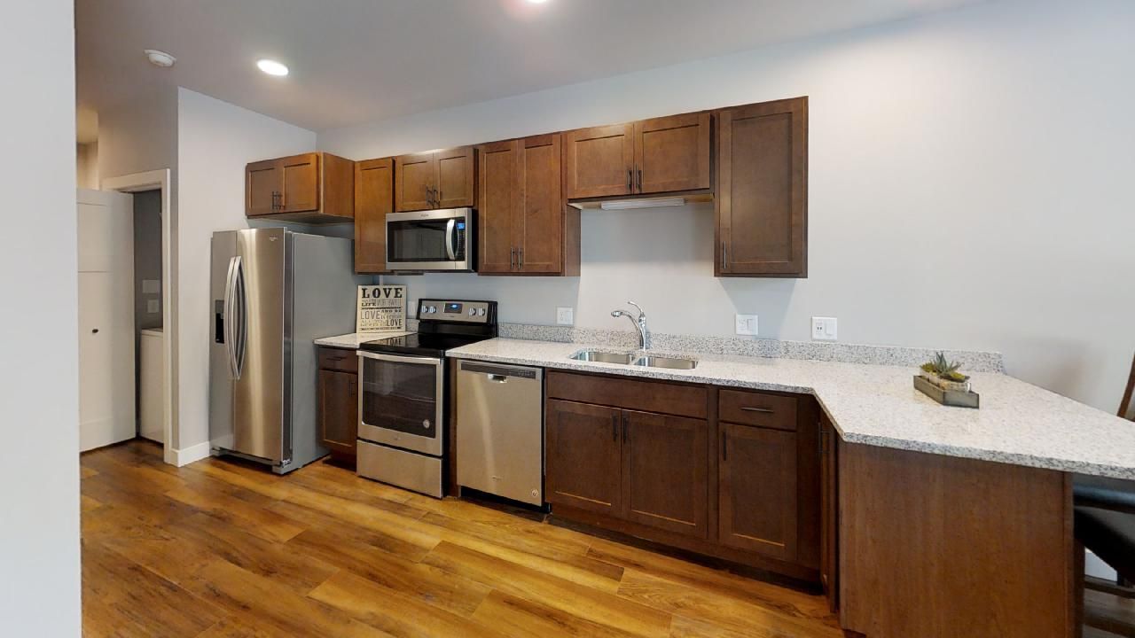a kitchen with a sign that says love on it