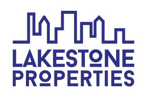 a blue logo for lakestone properties with a city skyline in the background .