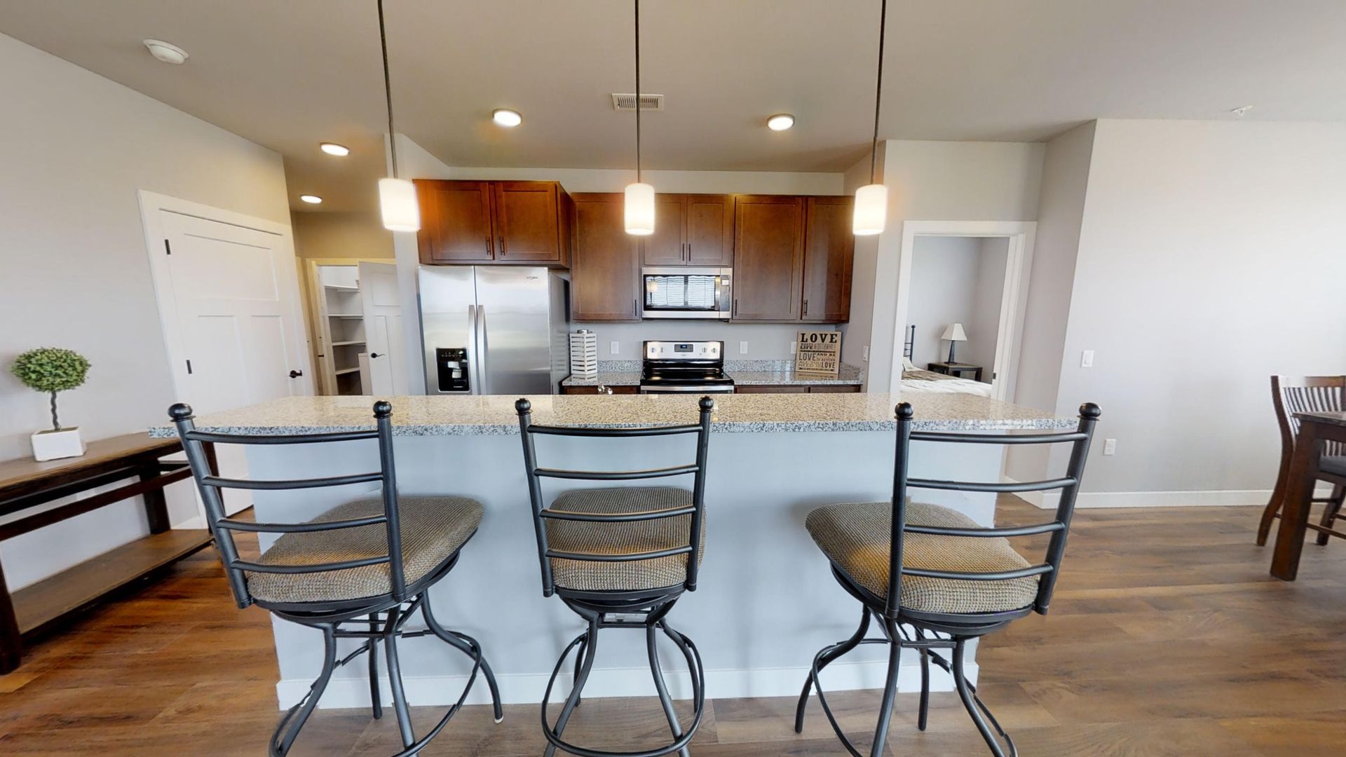 a kitchen with a sign that says love on it