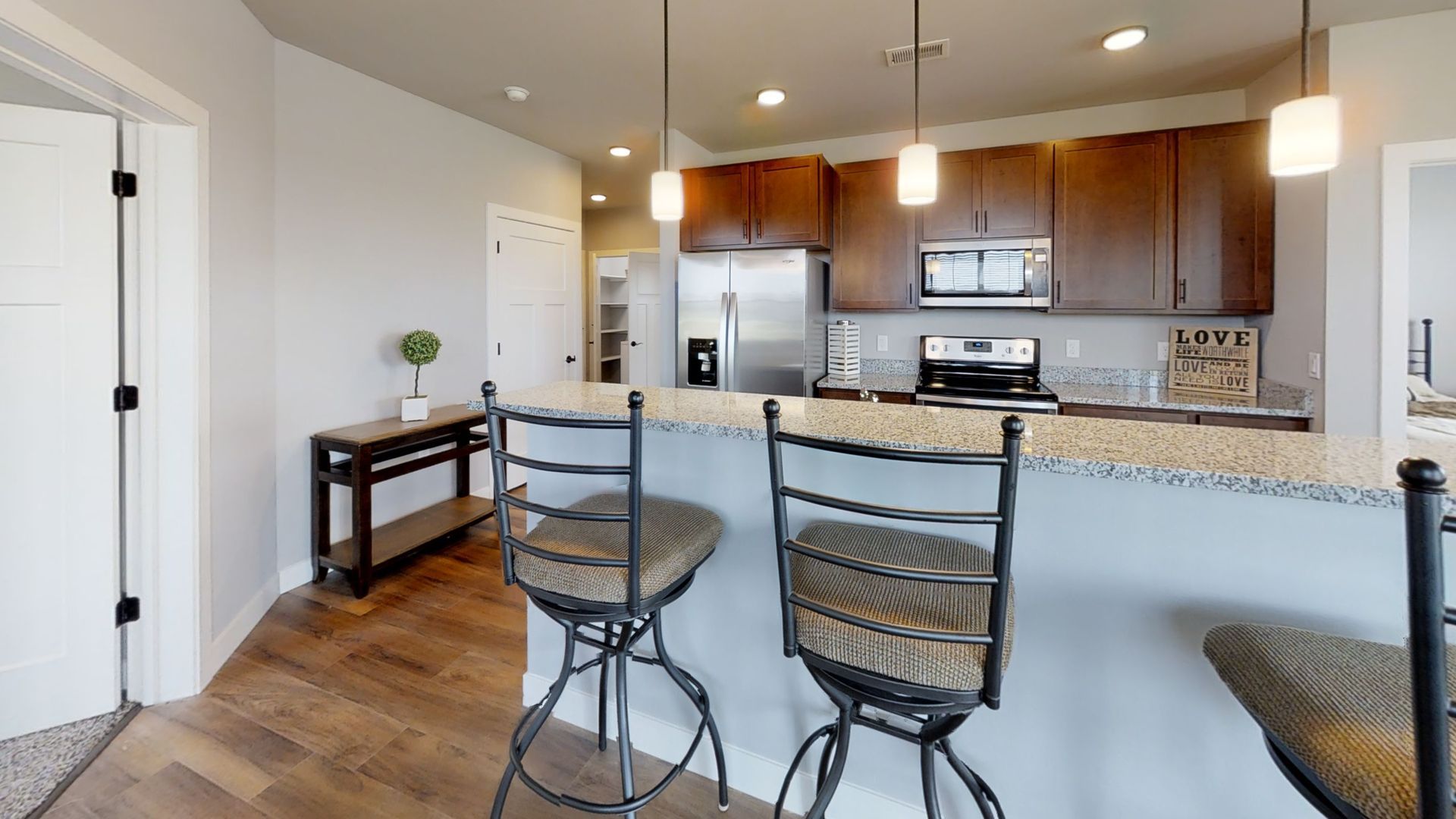a kitchen with a sign that says love on it