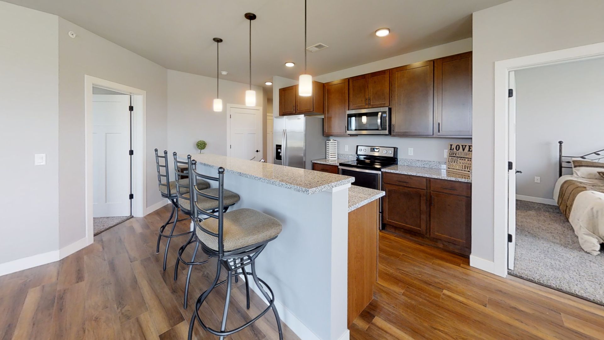 a kitchen with a sign that says love on it