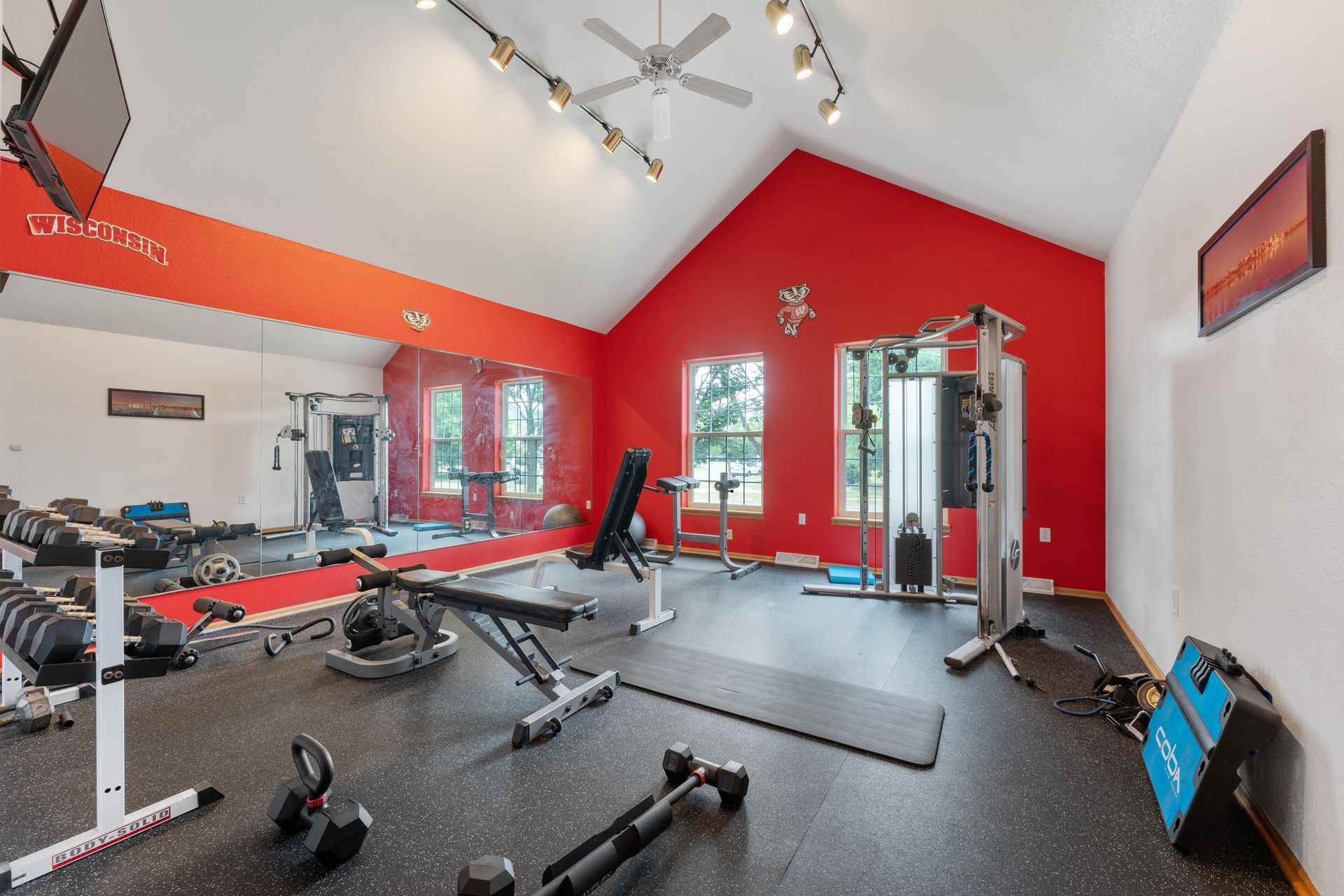 a gym with wisconsin painted on the wall