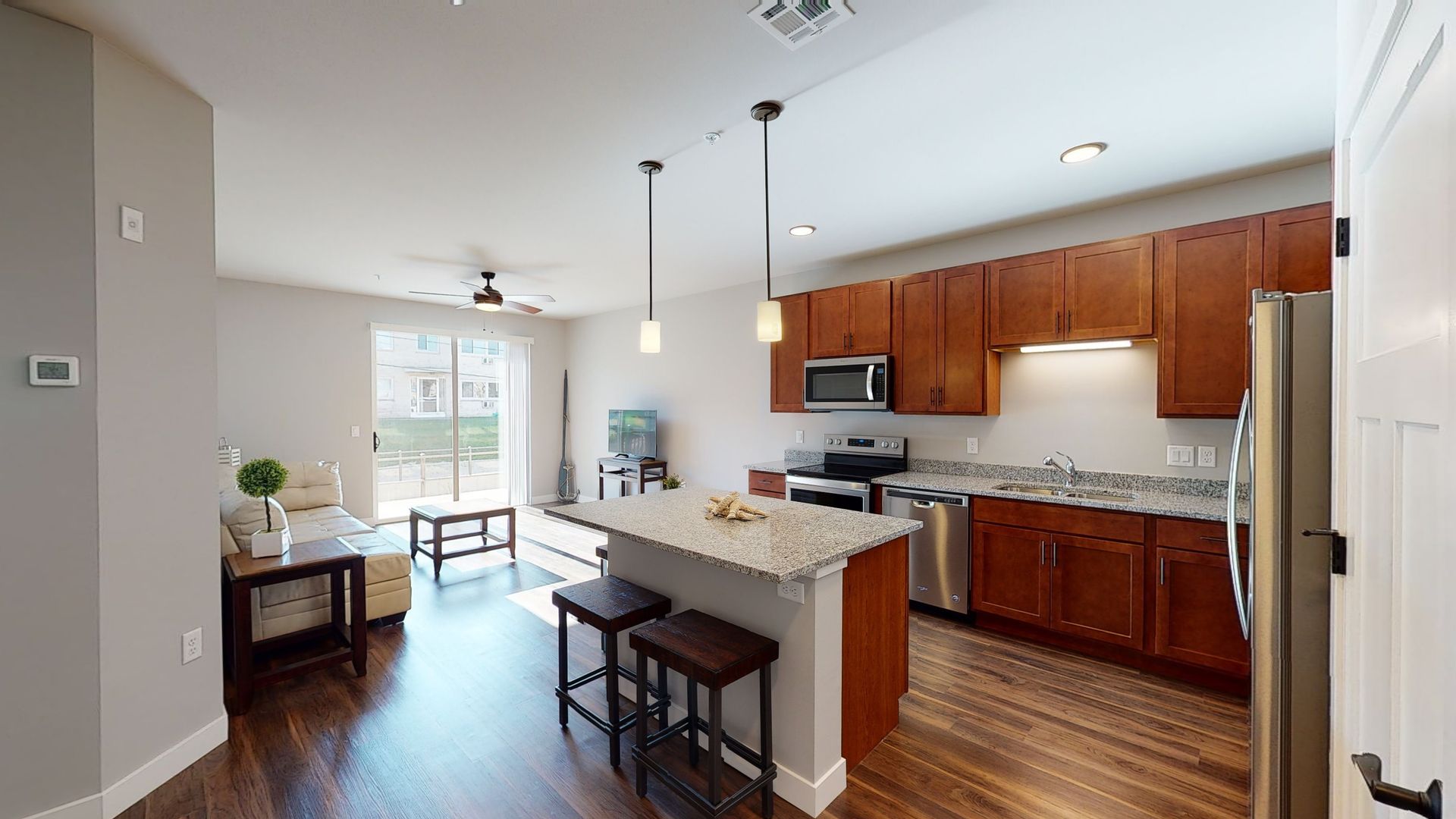a kitchen with stainless steel appliances and granite counter tops