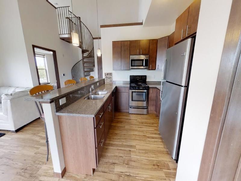 a kitchen with a sign on the wall that says cave