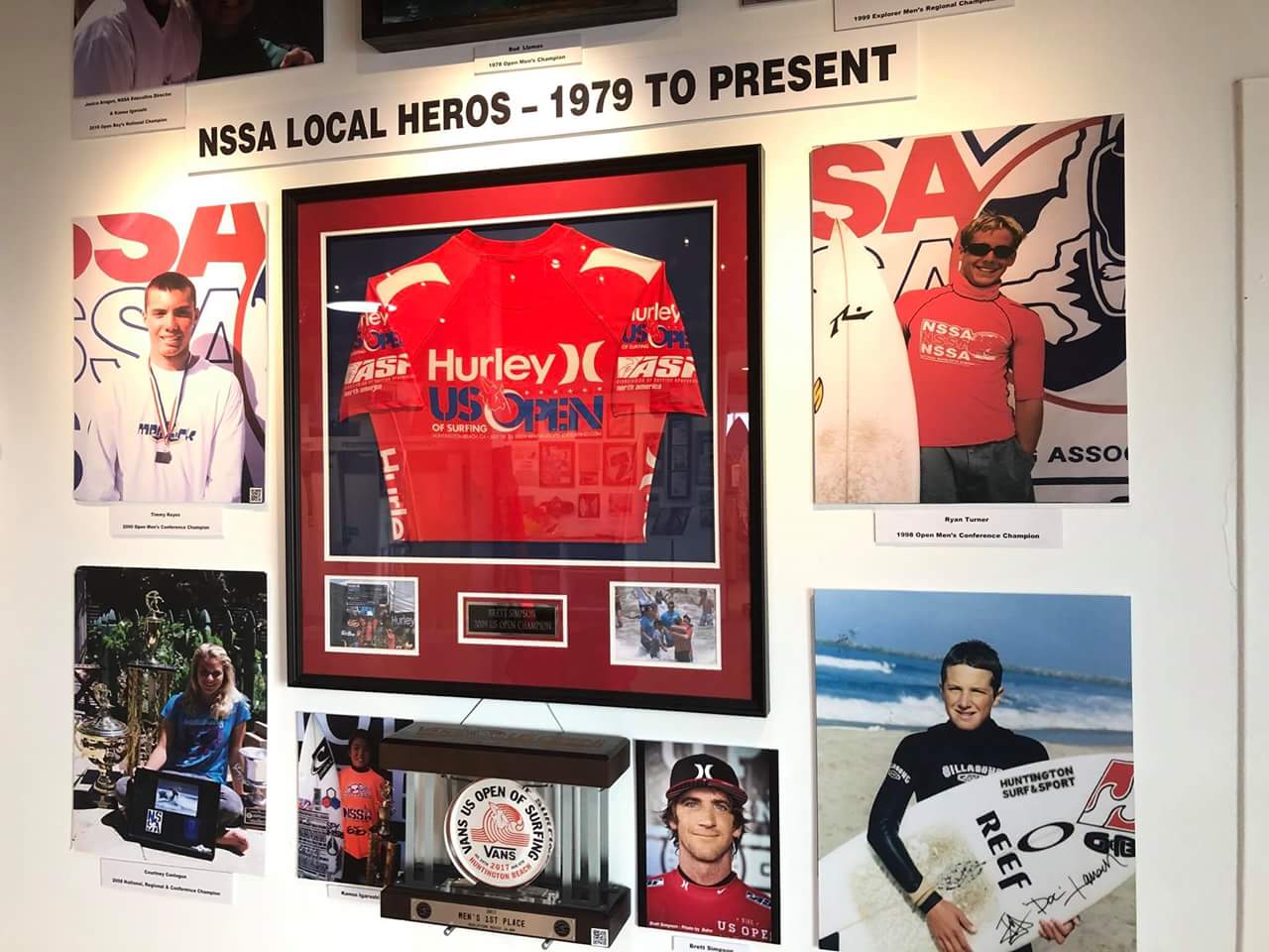 A wall with a picture of a hurley shirt on it