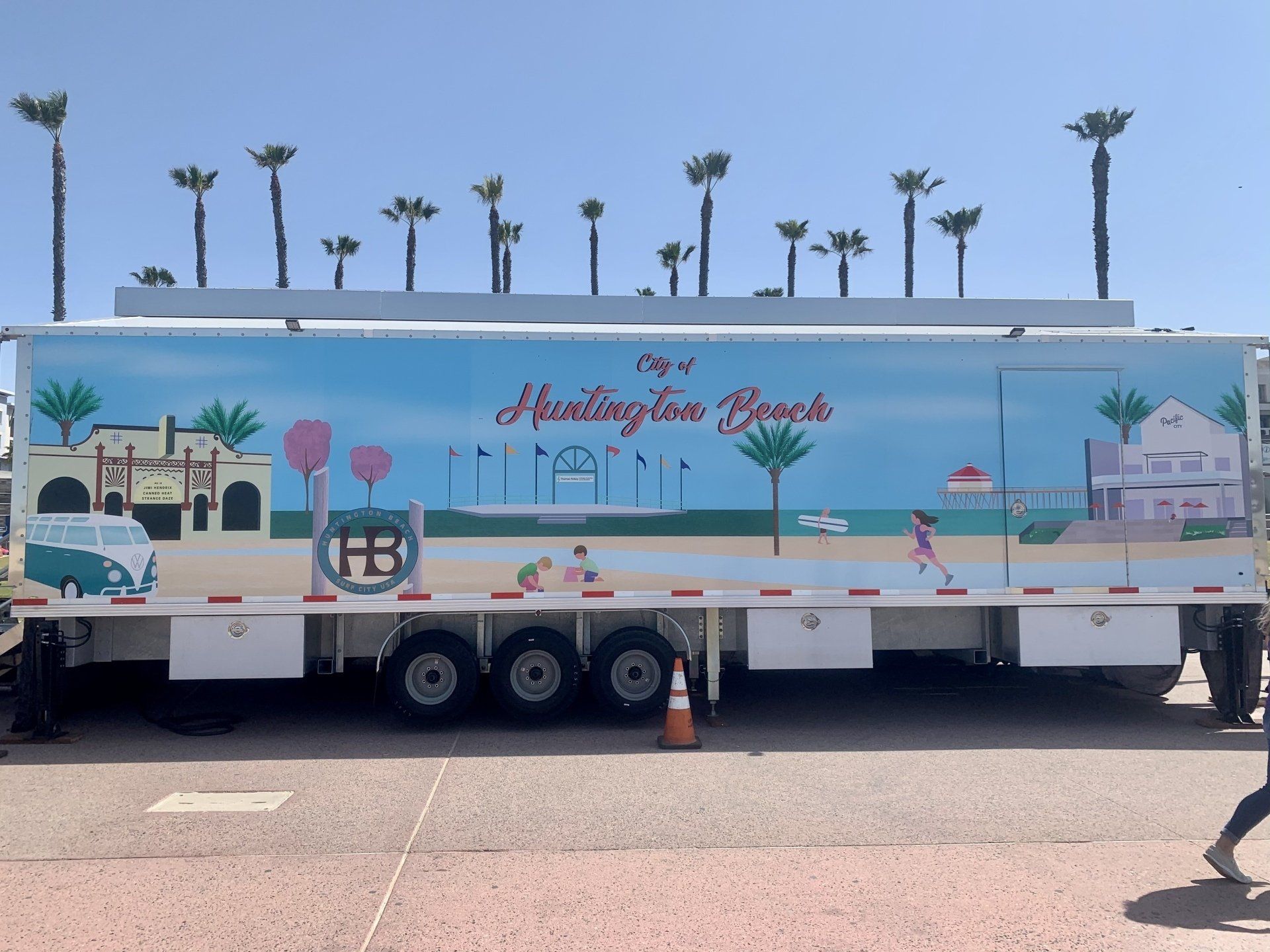 A trailer that says huntington beach is parked on the side of the road