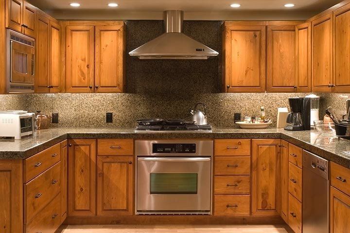 Kitchen with Wooden Cabinet — Kansas City, MO — At Your Service Appliance Repair