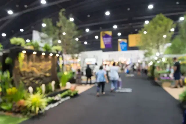 A group of people are standing in front of a sign that says pr lite