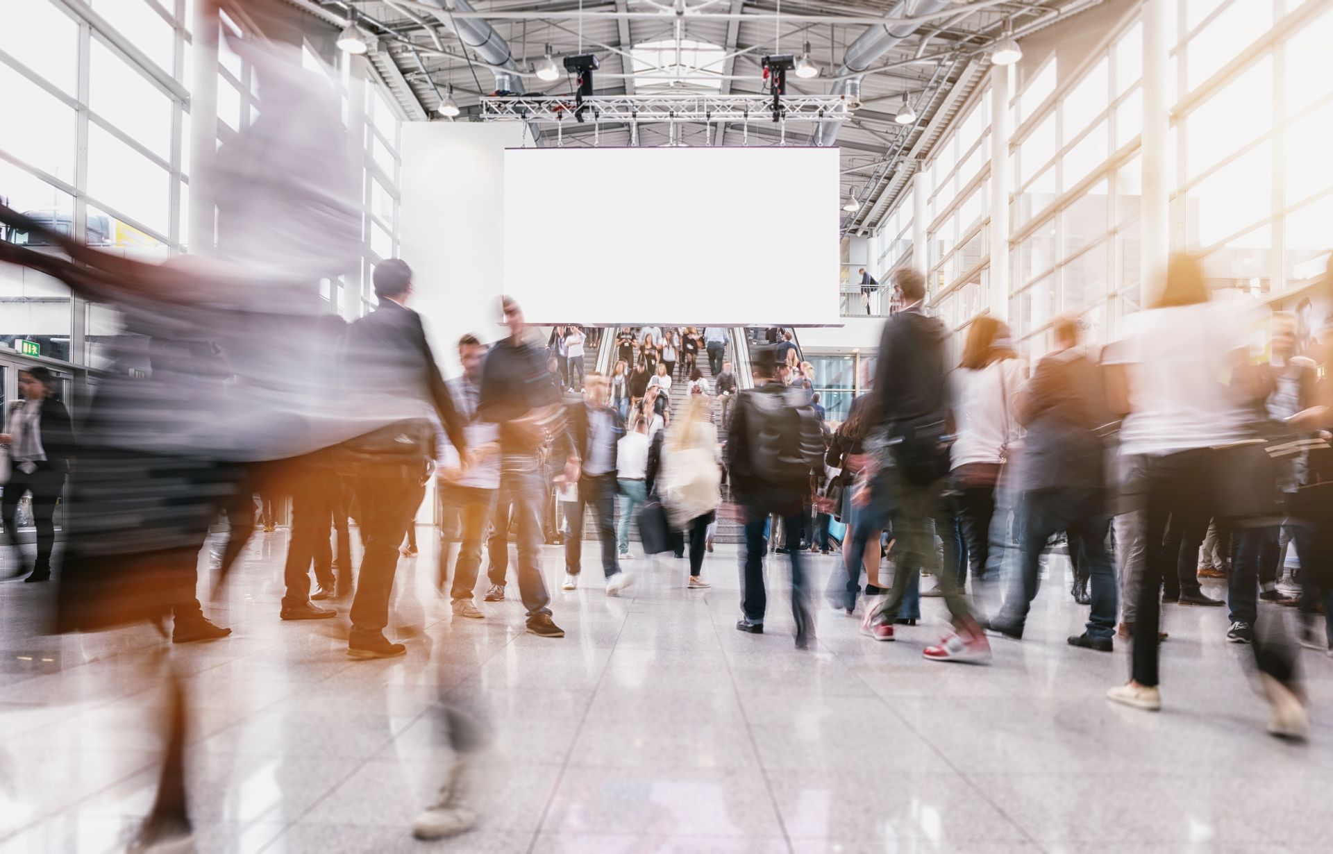 An aerial view of a large building filled with lots of vehicles and buildings.