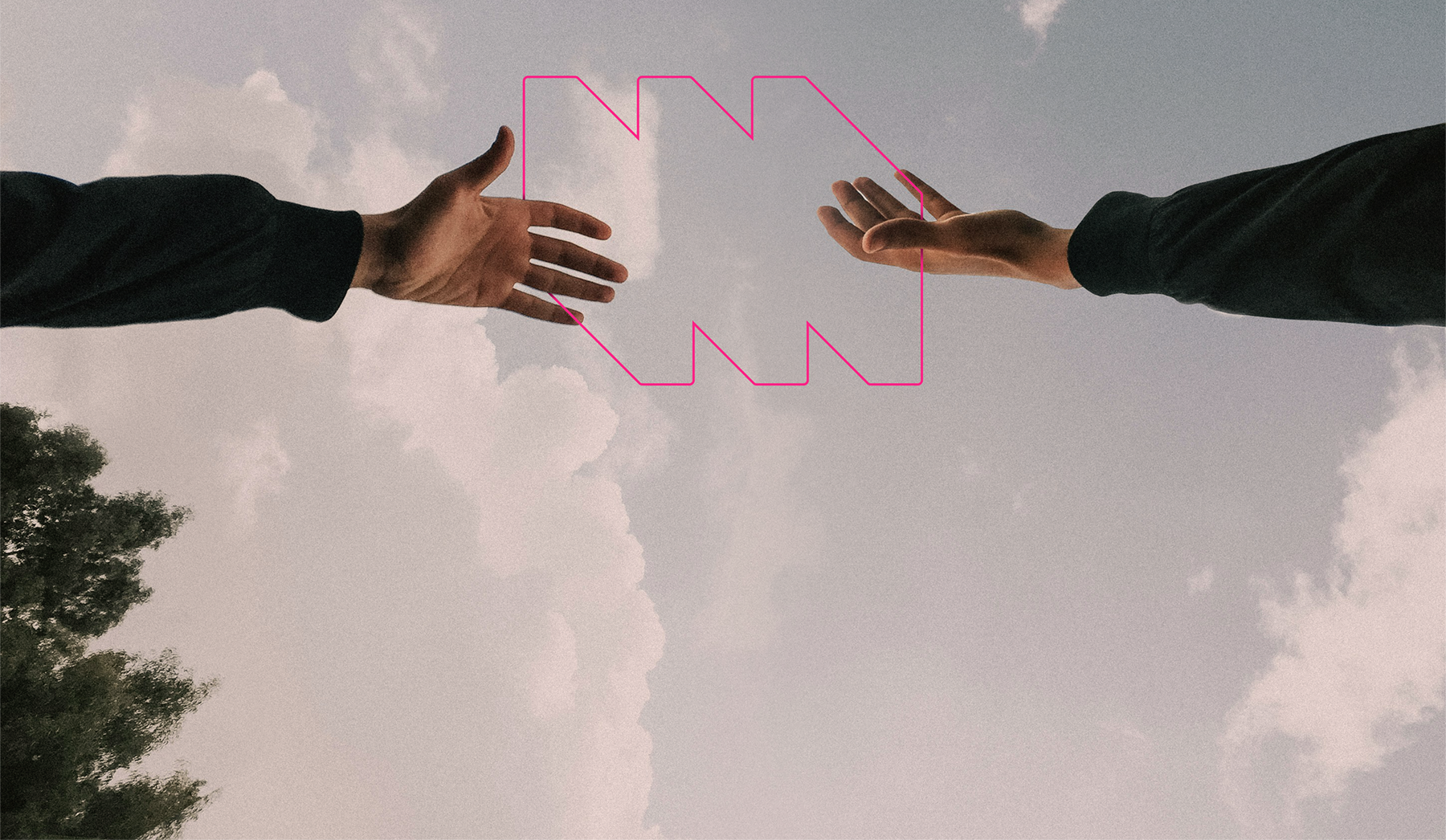 Two hands reach towards each other against a cloudy sky, a pink geometric shape between them.