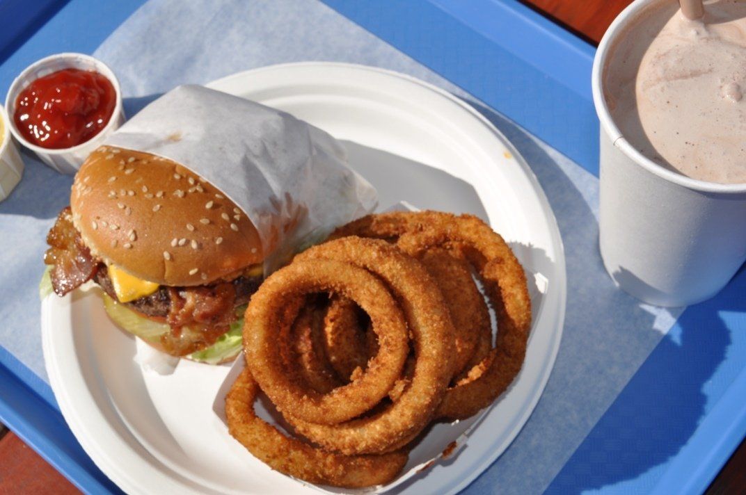 burger, onion rings and shake