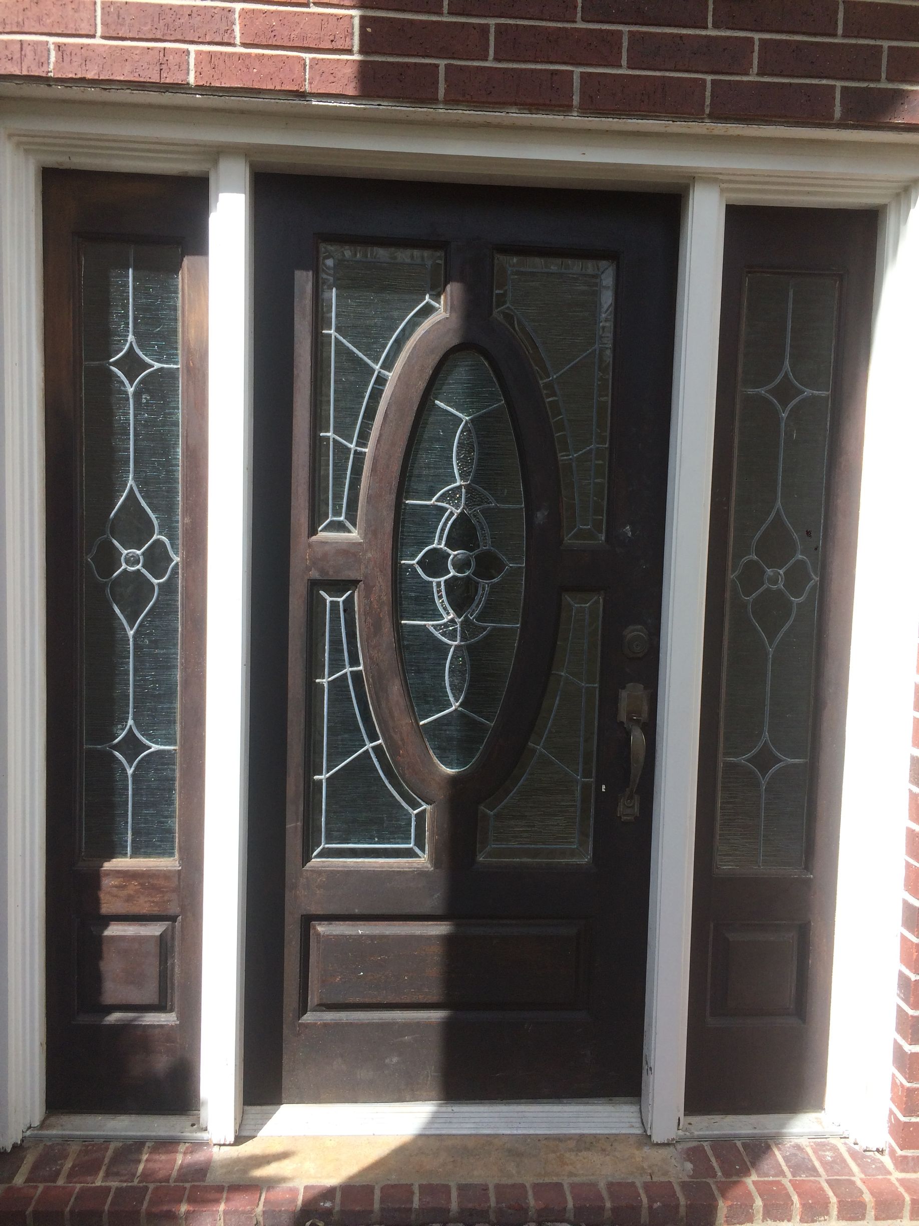 The front door of a house with a planter of flowers in front of it