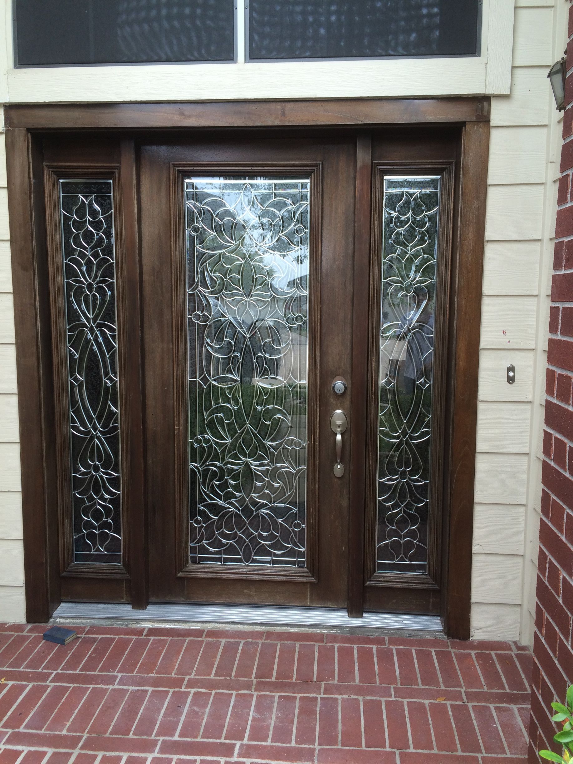 A person is installing a window with a drill.
