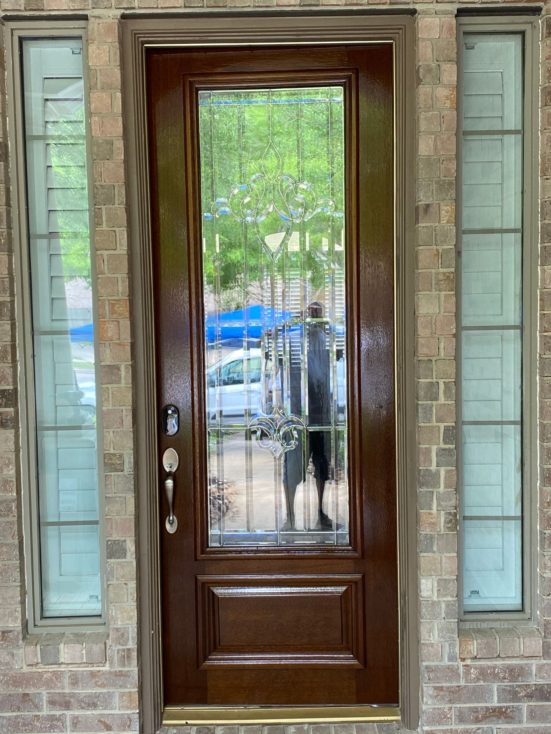 The front of a house with a garage and a porch.