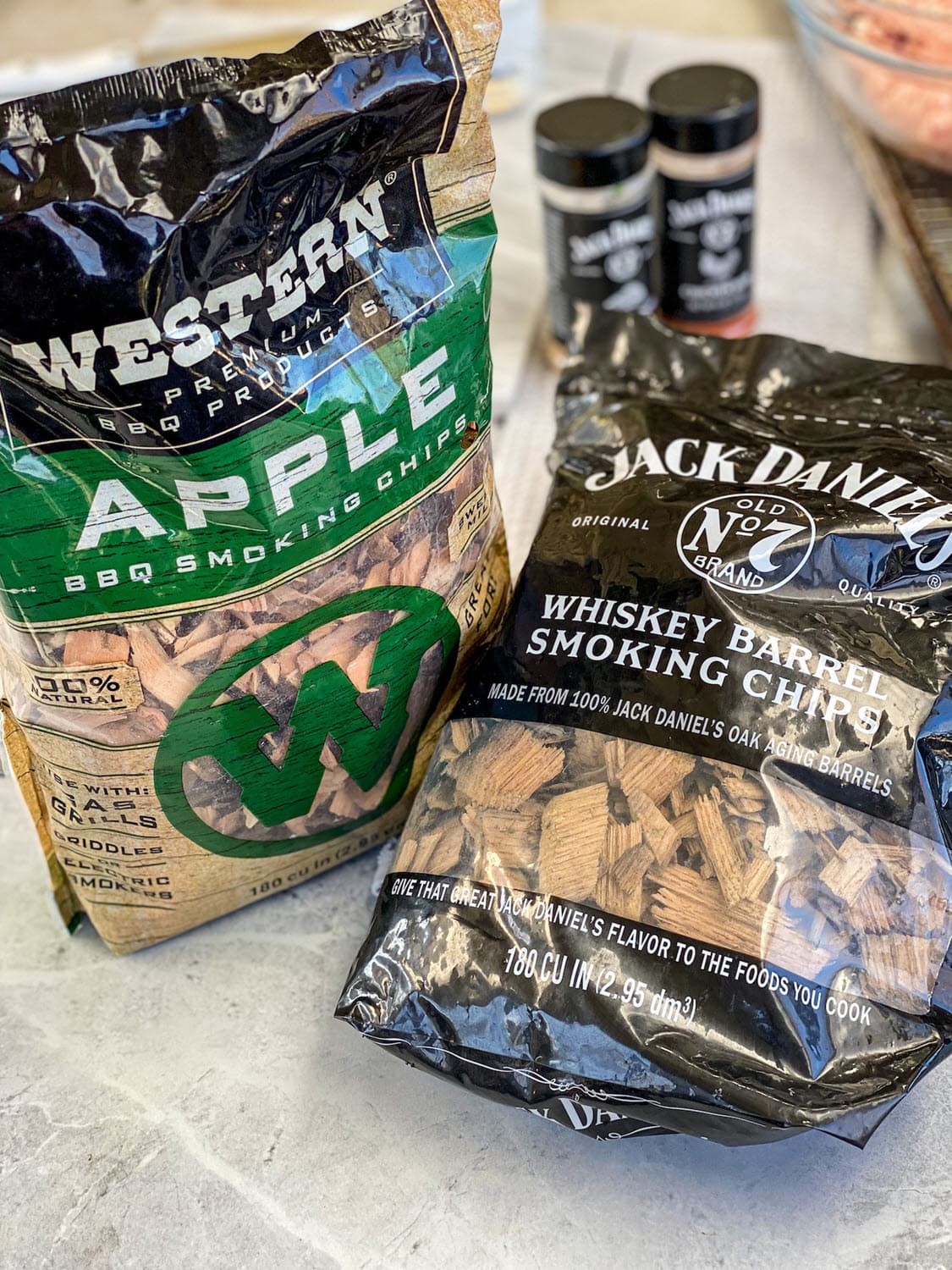 Western Apple Smoking Chips bag, Jack Daniel's Whiskey Barrel Smoking Chips and Jack Daniel's rubs in background