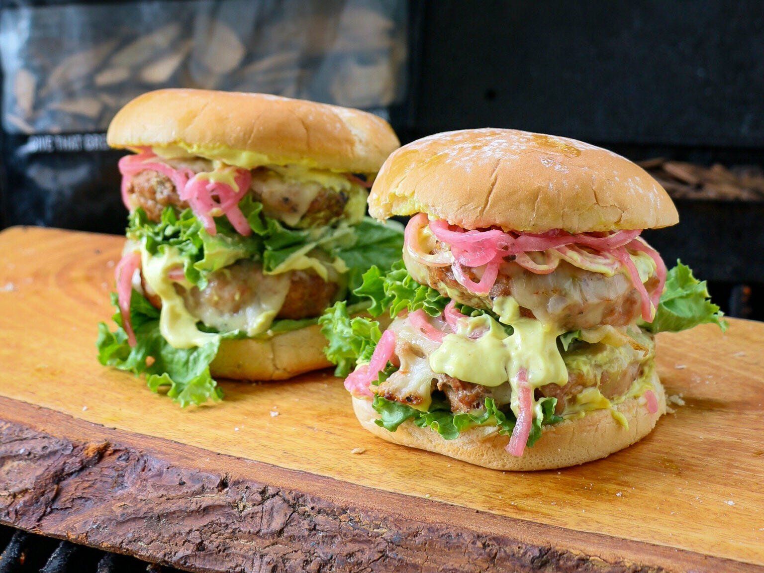 Jack Daniel's® Whiskey Barrel Smoked Pork Burger with pickled onion, lettuce and creamy mustard