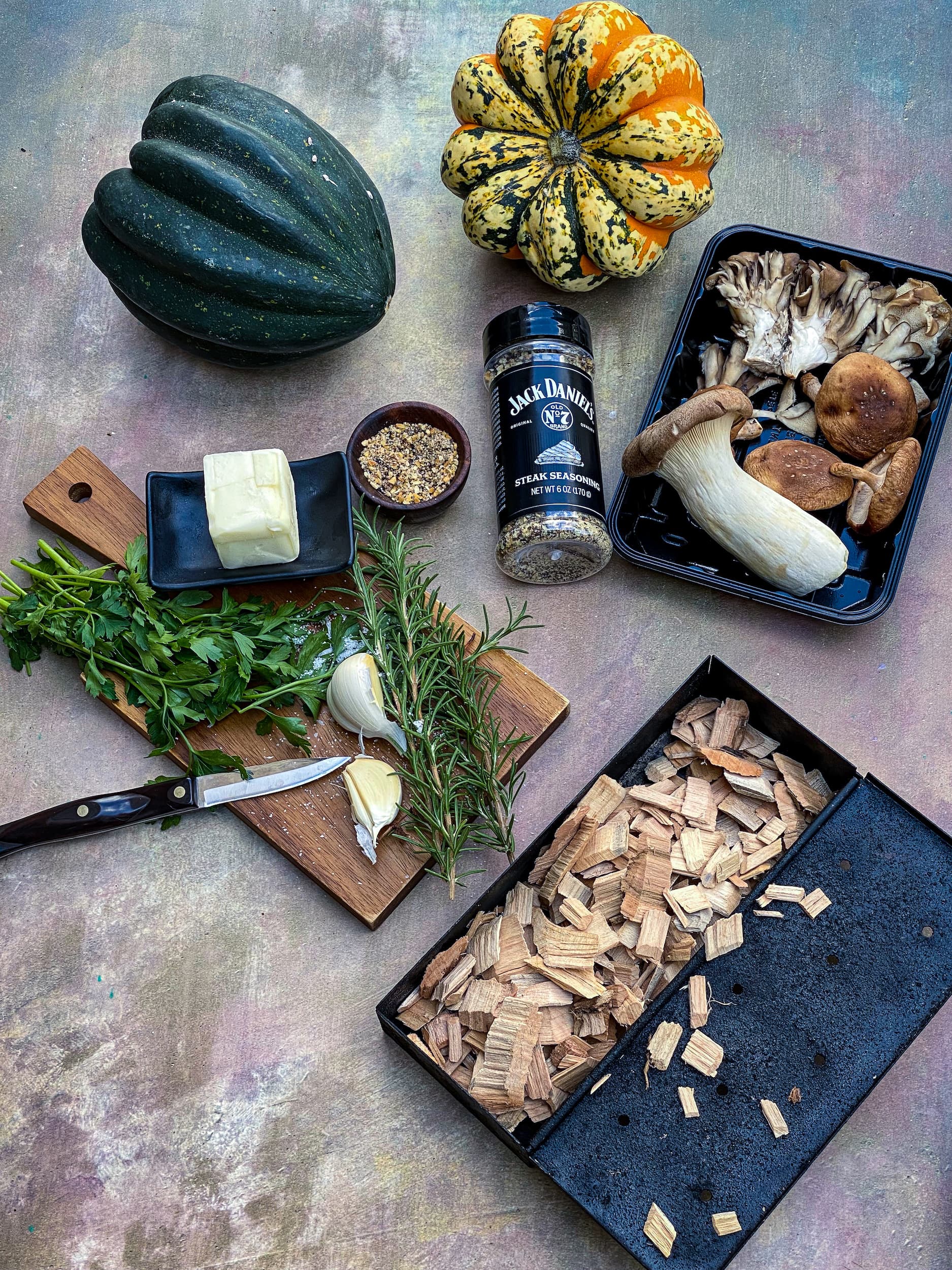 ingredients squash, herbs, butter, mushrooms, garlic and BBQ smoking chips