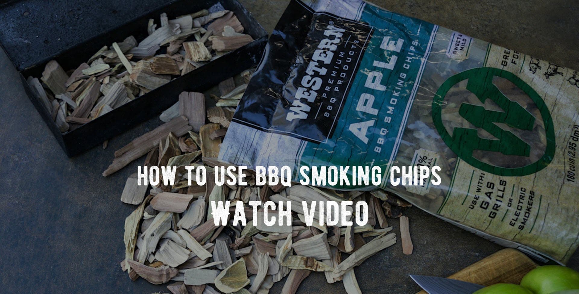 Western apple smoking chips on surface and in smoker box with text how to use smoking chips watch video