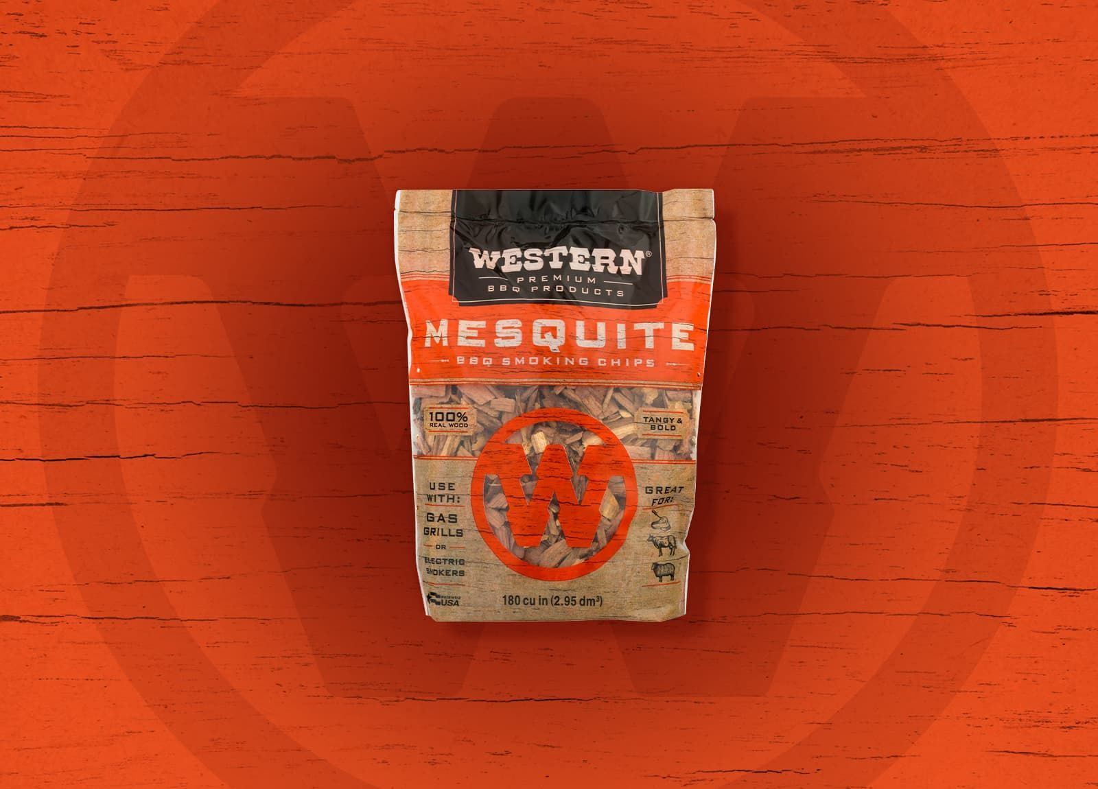A bag of Western Mesquite BBQ wood chips on an orange wooden background