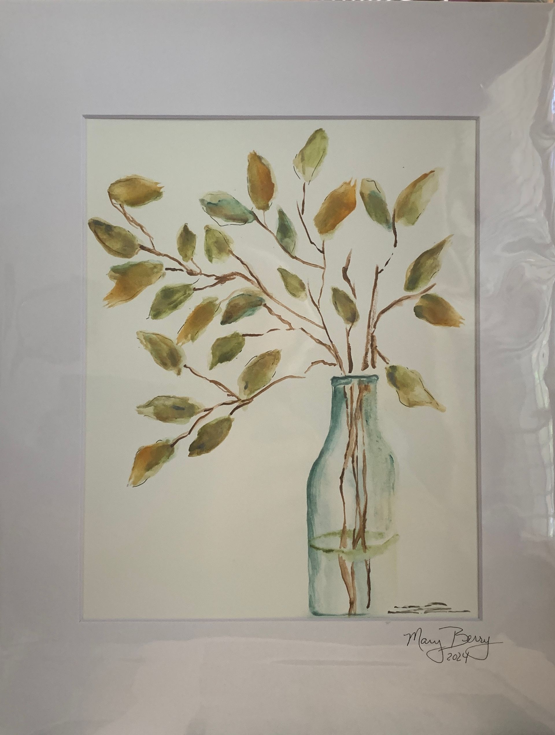 Watercolor painting of branches with green and gold leaves in a clear glass bottle against a white background.  By Mary Berry - Art