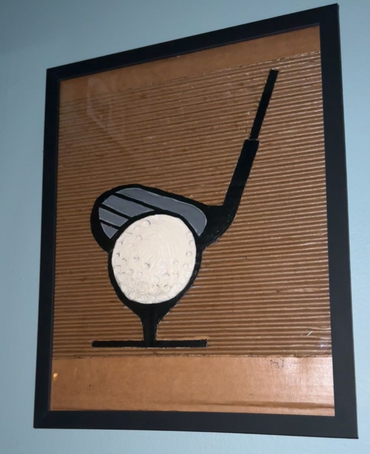 Golf club hitting a ball on a tee. Brown, black, and white colors with a corrugated background.  By Mary Berry - Art