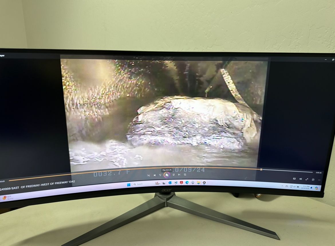 A computer monitor showing the video footage of a pipeline video inspection.