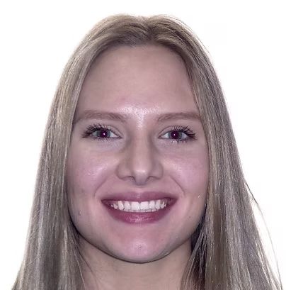 Smiling person with light-colored hair looking at the viewer.