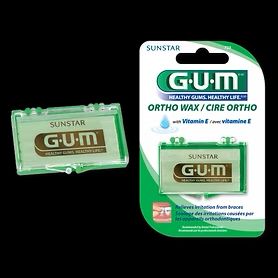 G-U-M ortho wax: a clear case containing green wax, next to its green and white packaging, both with the G-U-M logo.